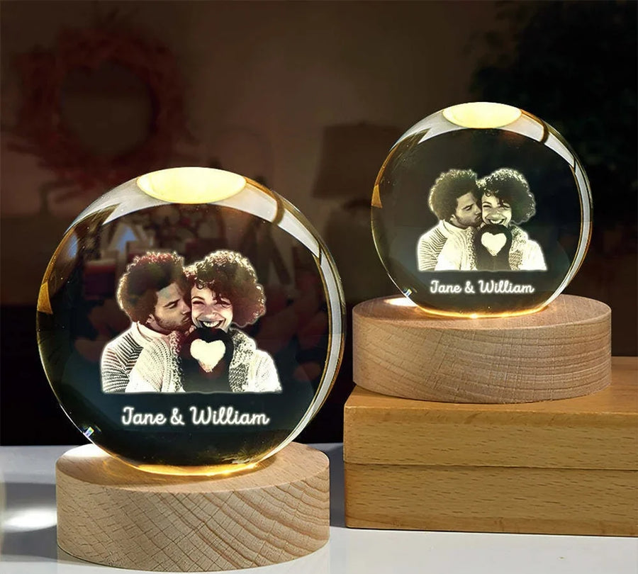 Personalized crystal spheres glowing on wooden LED bases