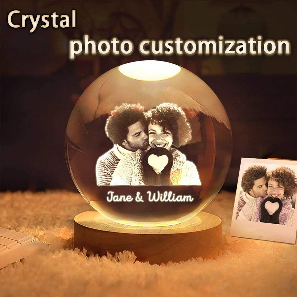 Custom photo crystal ball glowing on wooden LED base