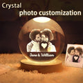 Custom photo crystal ball glowing on wooden LED base